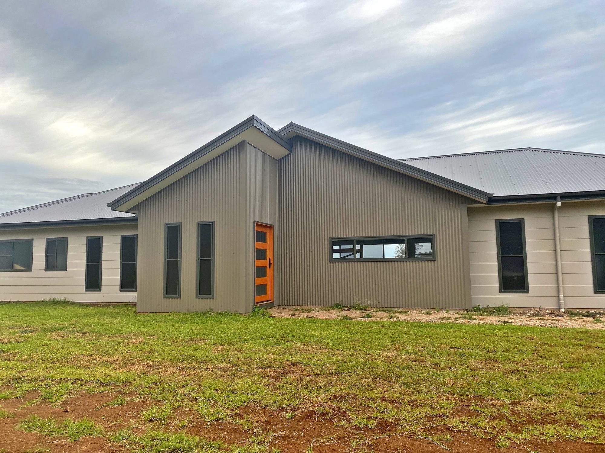Stuart from Gunnedah, NSW loves COLORBOND® steel.  Walling made from COLORBOND® steel in colour Woodland Grey®, Dune® and Gully®