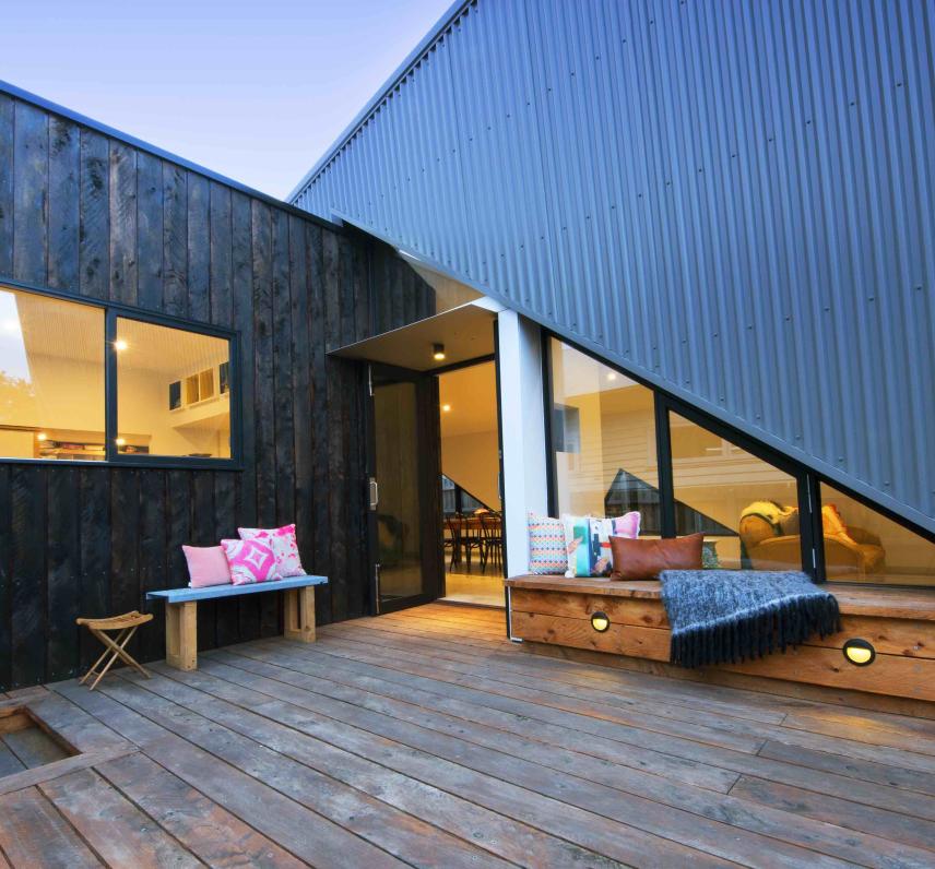 Arrow House in Footscray, VIC,  by Mark Lam Architect, is clad in a mixture of black-stained timber and COLORBOND® steel in the colour Wallaby® in profile  Lysaght SPANDEK®