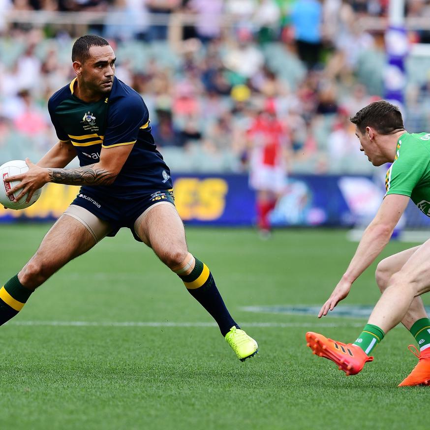 Shaun Burgoyne of Australia competes with Shane Walsh