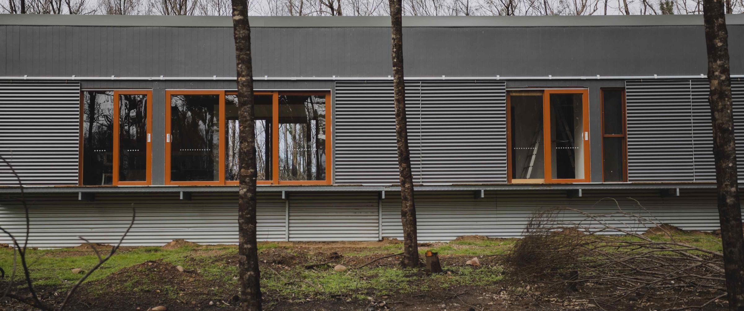 The house that withstood a bushfire. Uses framing made from TRUECORE® steel, COLORBOND® steel cladding, roofing, fire shutters and flashing