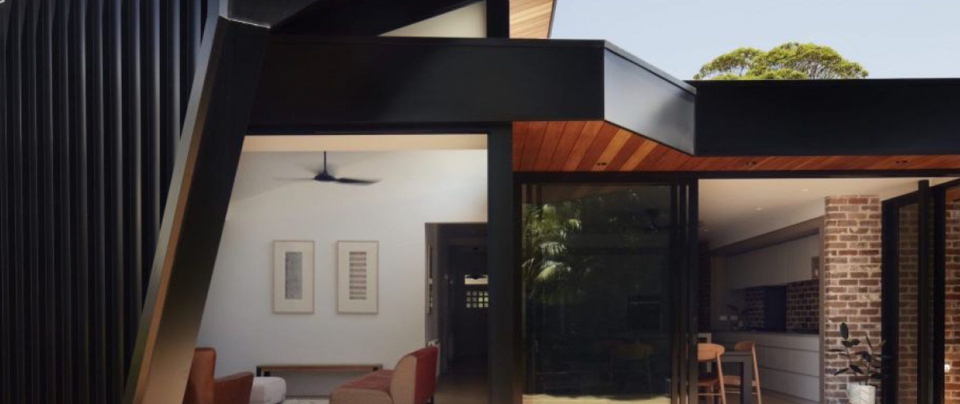Blinker House' by Alchemy Architecture. Profile: LYSAGHT LONGLINE 305®. Walling: COLORBOND® steel cladding in the colour Night Sky®. Architect: Alchemy Architecture. Photographer: Luc Redmond. Builder & Trades: Enter Building Group