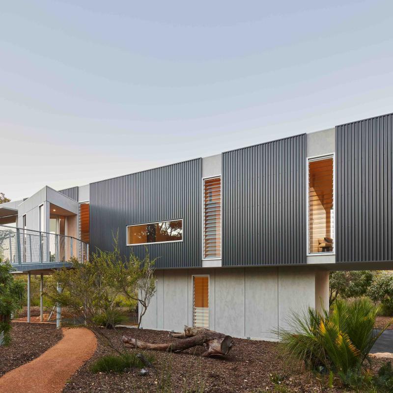 COLORBOND® steel Monument® (cladding) and COLORBOND® steel Shale Grey® (roofing, not shown) in LYSAGHT SPANDEK® (cladding) and LYSAGHT TRIMDEK® (roofing) profiles.