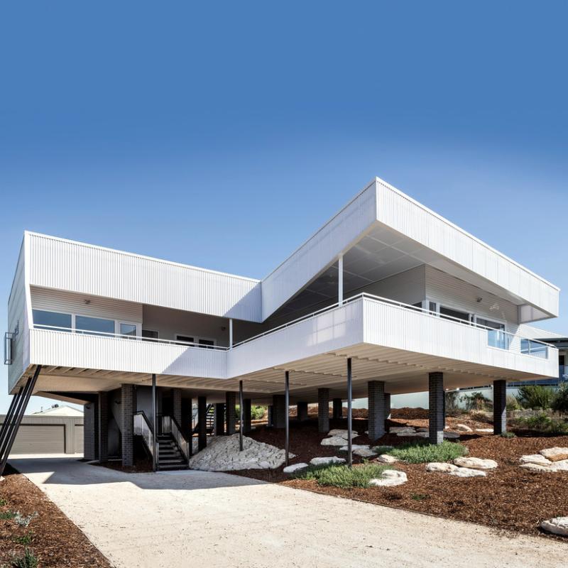 COLORBOND® Ultra steel Surfmist® and Monument® in LYSAGHT CUSTOM ORB® profile.