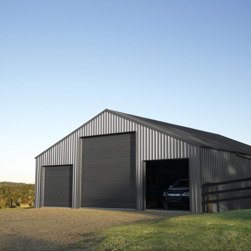 Farm Shed with door open with ute inside