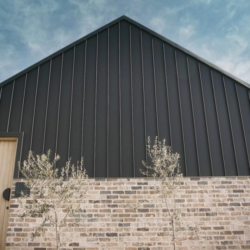 The Barn, Glenquarry NSW, designed by Solis Haus Building Design.  Roofing and Walling made from COLORBOND® steel in colour Monument® Matt