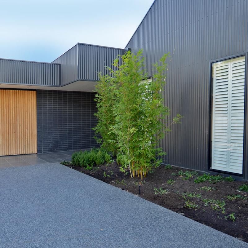 COLORBOND® steel Monument® in LYSAGHT CUSTOM ORB® profile for the walling, and LYSAGHT KLIP LOK® for the roofing