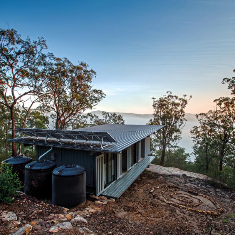 Residential home in Central Coast Hinterland, NSW. Roofing made from COLORBOND® steel in LYSAGHT KLIP-LOK® 700 profile in the colour Ironstone®. Drew Heath Architect 