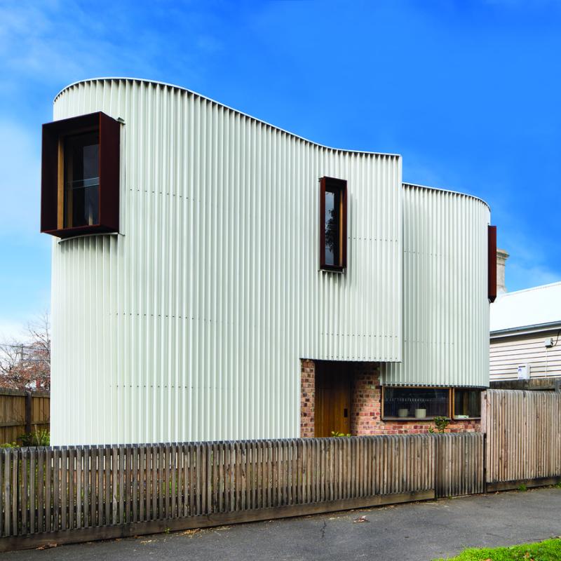 Walling made from COLORBOND® Metallic steel in a Design Sheet Metal (DSM) custom-made profile, in the colour Galactic®. Roofing made from COLORBOND® steel in Stramit Speed Deck Ultra® profile, in the colour Ironstone®. TANDEM Design Studio