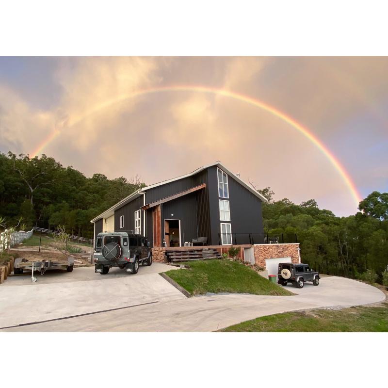 Trudi from Maudsland, QLD loves COLORBOND® steel. Barn house Roofing, Garage Doors, Walling made from COLORBOND® steel in colour Surfmist® and Monument® Matt