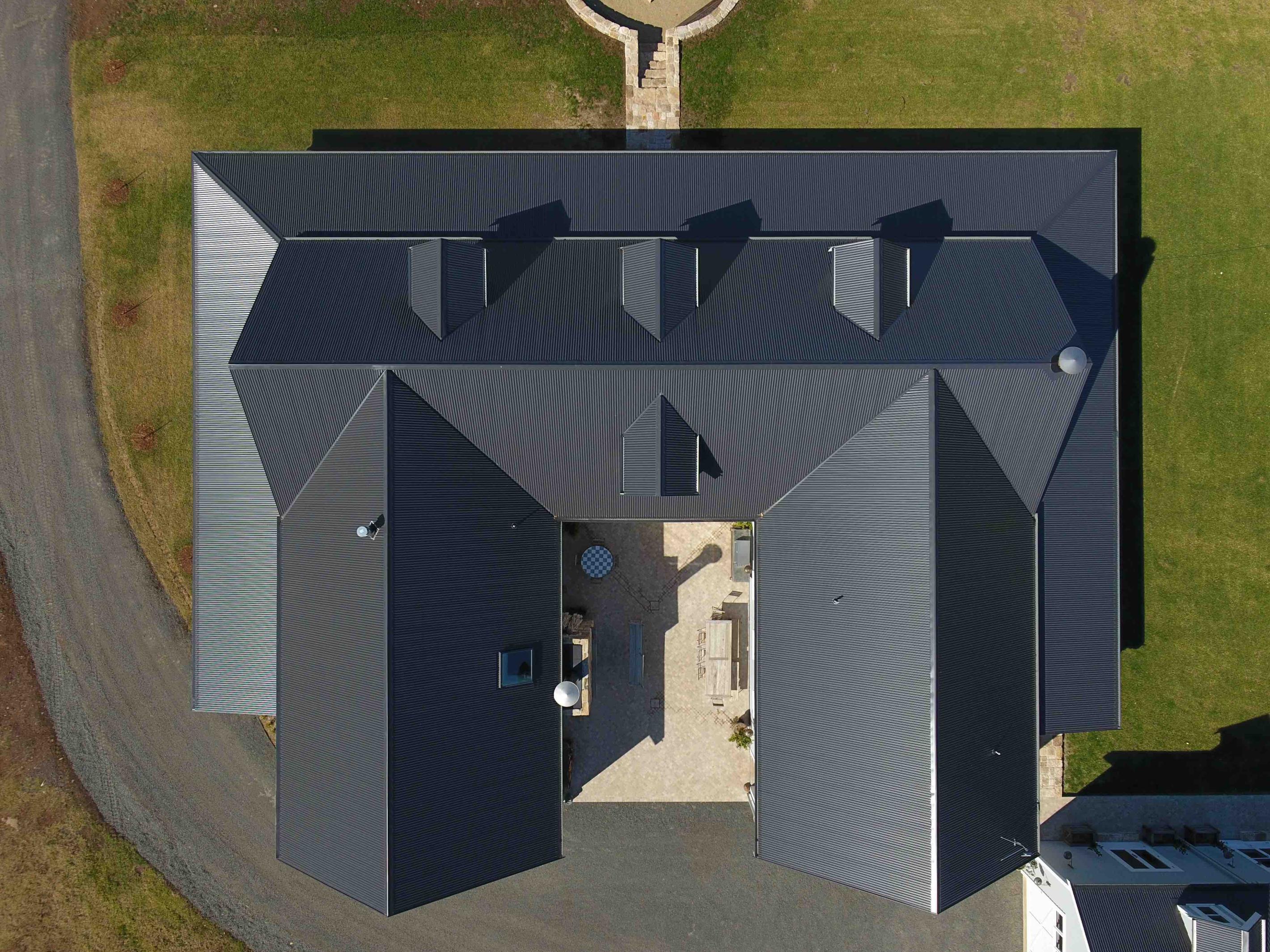 COLORBOND® steel Monument® roofing in LYSAGHT CUSTOM ORB® profile.