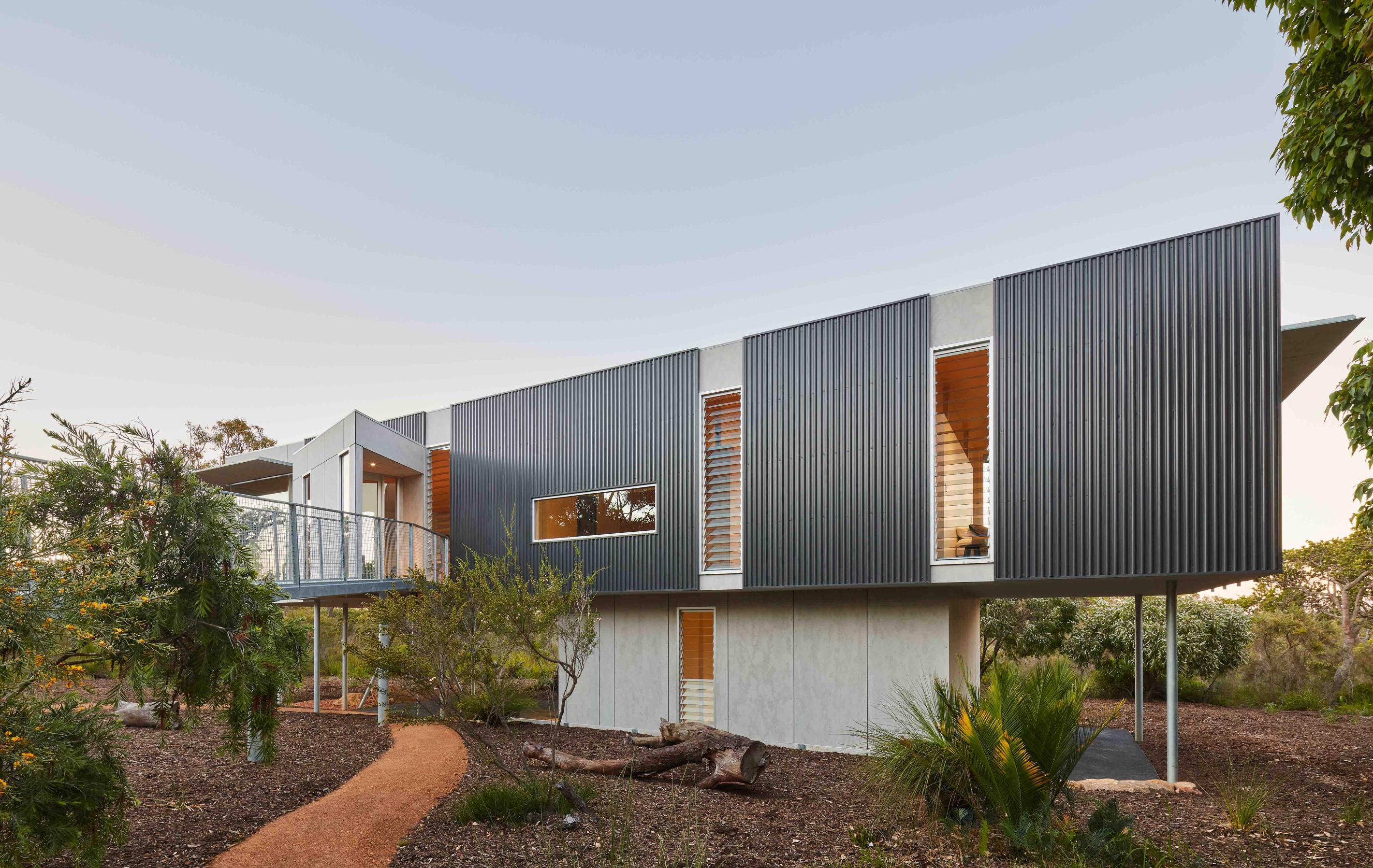 COLORBOND® steel Monument® (cladding) and COLORBOND® steel Shale Grey® (roofing, not shown) in LYSAGHT SPANDEK® (cladding) and LYSAGHT TRIMDEK® (roofing) profiles. 