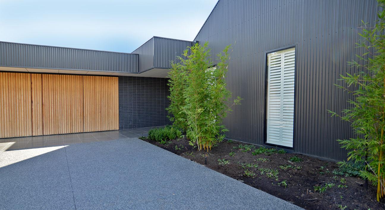 COLORBOND® steel Monument® in LYSAGHT CUSTOM ORB® profile for the walling, and LYSAGHT KLIP LOK® for the roofing