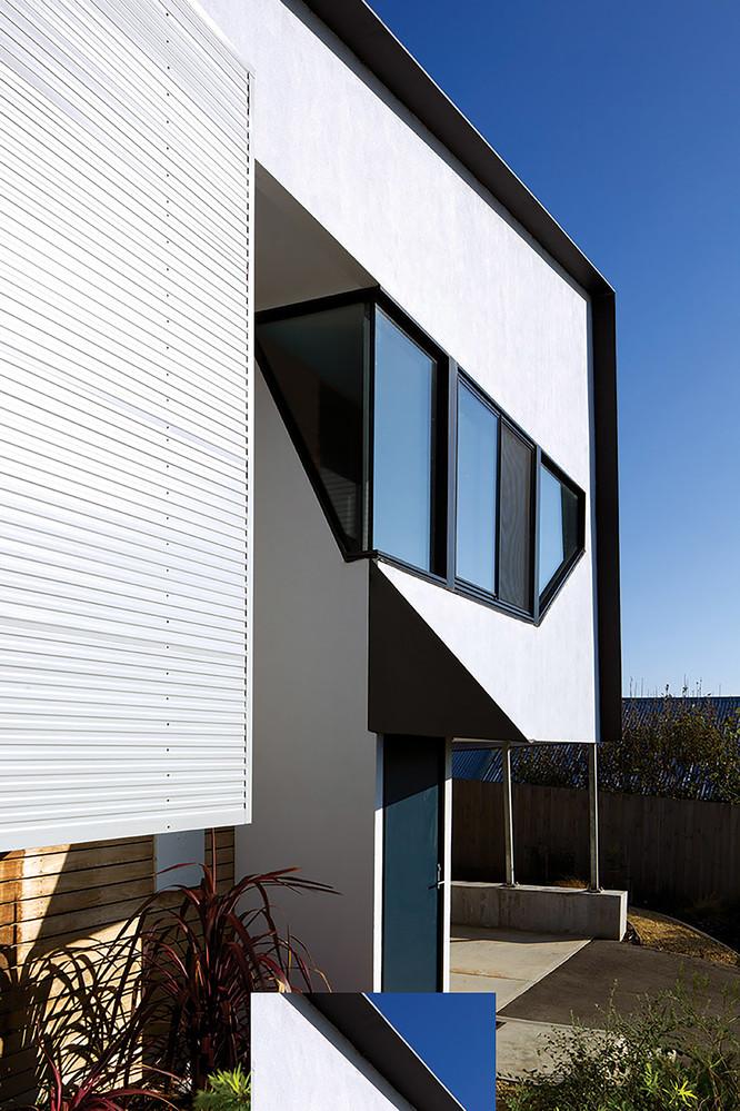 Home in Port Fairy, Victoria. walls are clad in COLORBOND® steel in the colour Shale Grey® and the profile LYSAGHT® PANELRIB®. skillion roof made from COLORBOND® steel in the colour Ironstone®. WSH Architects