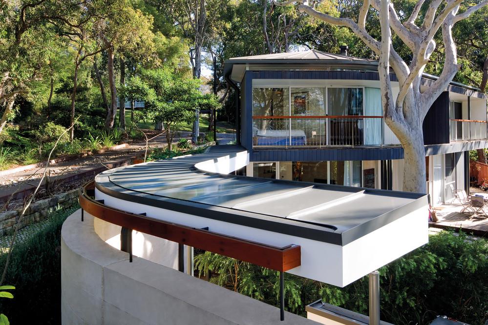 Home at  Palm Beach. on Sydney’s Northern Beaches. Roofing, Flat sheet made from COLORBOND® steel in the colour Woodland Grey®. Tanner Architects