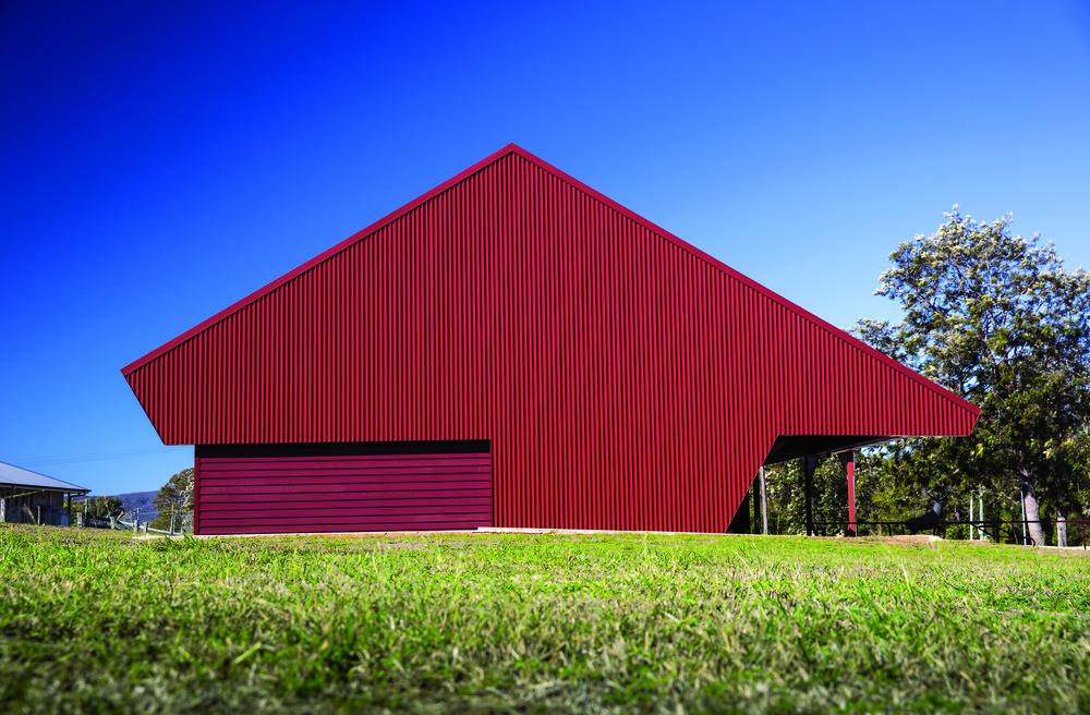The Condensery, Somerset Regional Art Gallery. Roofing and cladding made from COLORBOND® steel in Apex Apspan® 700 profile and Stramit® Corrugated profile in the colour Manor Red®. PHAB Architects