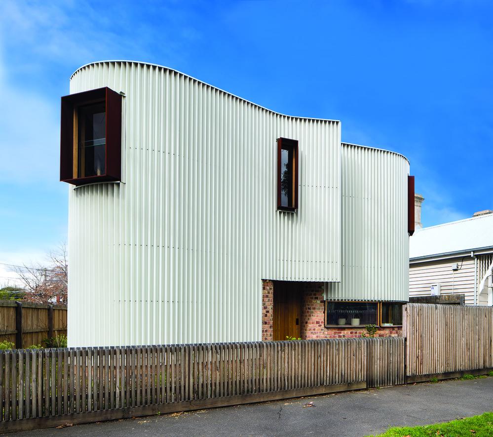 Walling made from COLORBOND® Metallic steel in a Design Sheet Metal (DSM) custom-made profile, in the colour Galactic®. Roofing made from COLORBOND® steel in Stramit Speed Deck Ultra® profile, in the colour Ironstone®. TANDEM Design Studio
