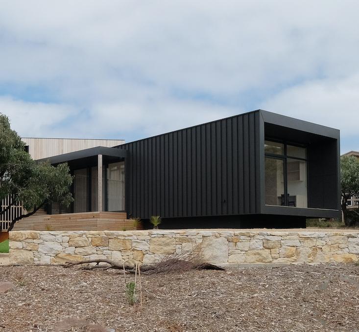 COLORBOND® steel Monument® Matt roofing and cladding in LYSAGHT ENSEAM® profile.