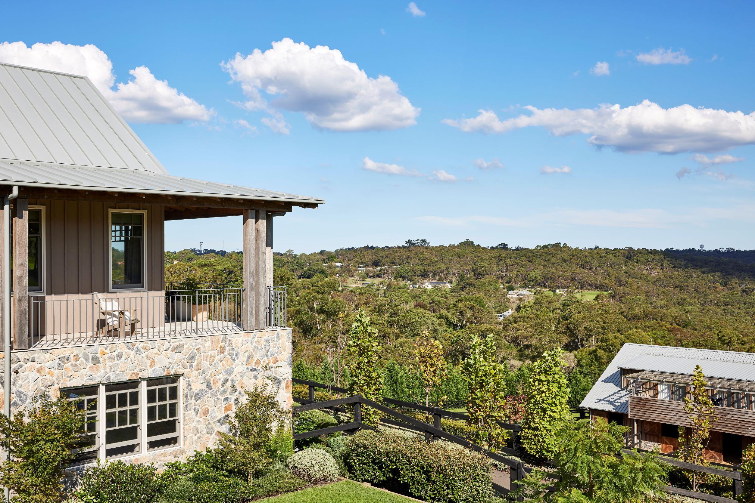 Home with COLORBOND steel roof in Windspray surrounded by bushland