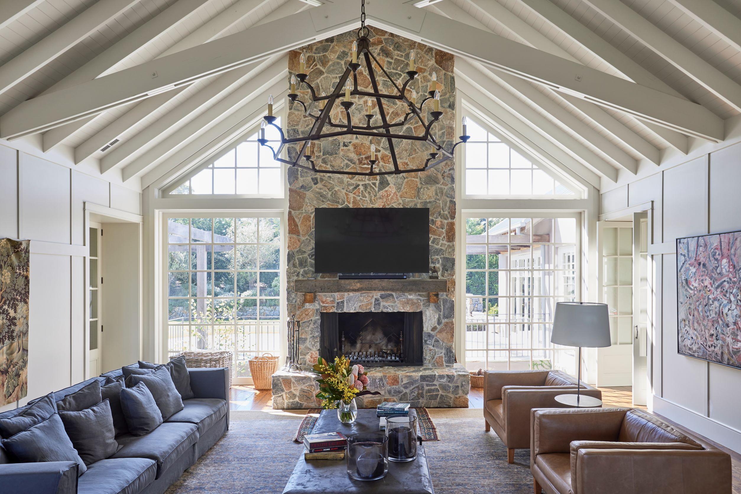 Living room with stone fireplace of home