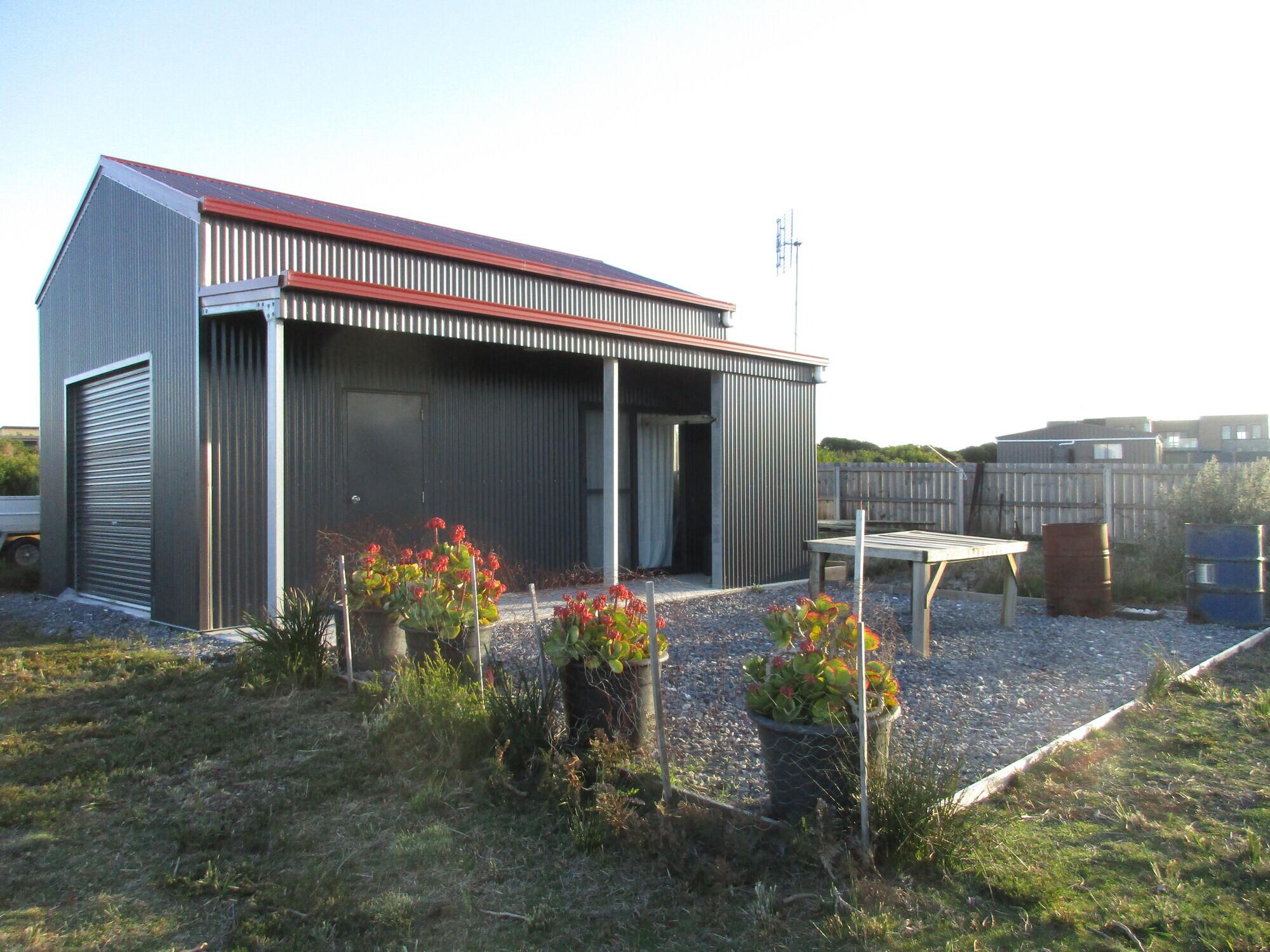 Veronica from Lulworth, TAS loves COLORBOND® steel. Roofing, Guttering & Fascia, Garage Doors, Sheds, Patio & Pergola made from COLORBOND® steel in colours Manor Red® and Monument® Matt