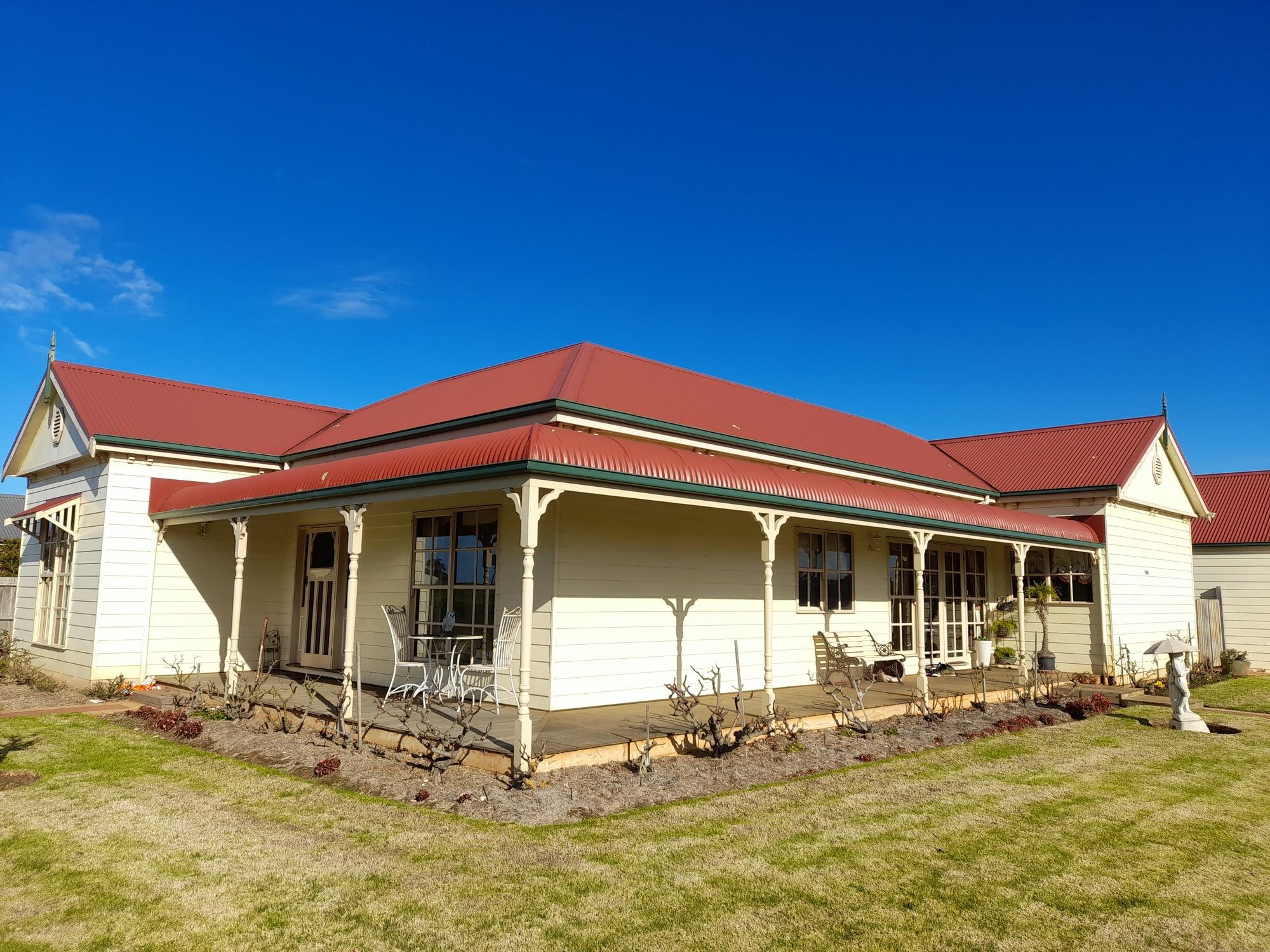Maree from Koroit, VIC loves COLORBOND® steel.  Roofing, Guttering & Fascia, Garage Doors made from COLORBOND® steel in colour Cottage Green® and Manor Red®