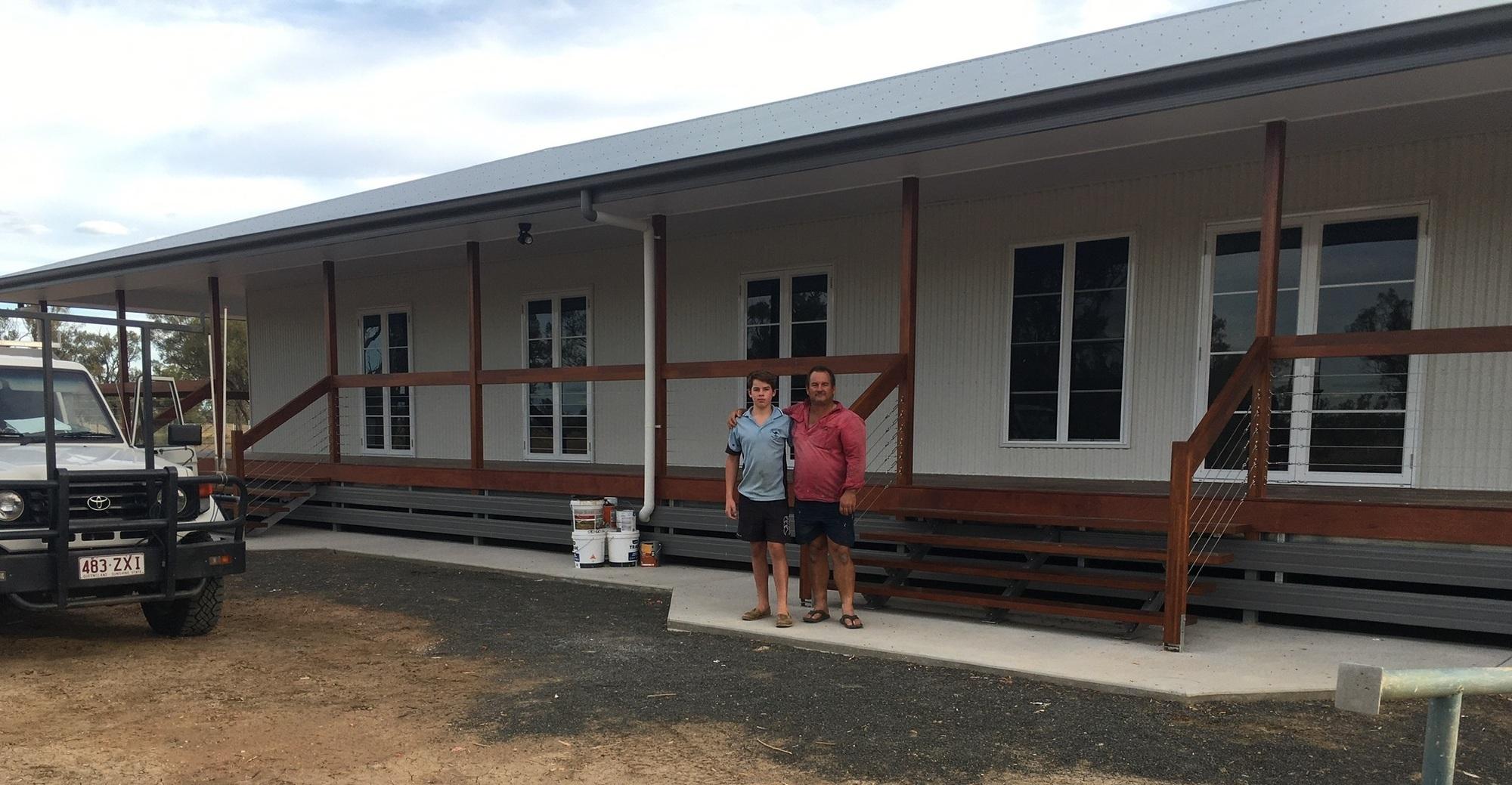 Brad from Charleville, QLD loves COLORBOND® steel. Guttering & Fascia, Walling made from COLORBOND® steel in colours Surfmist® and Wallaby®