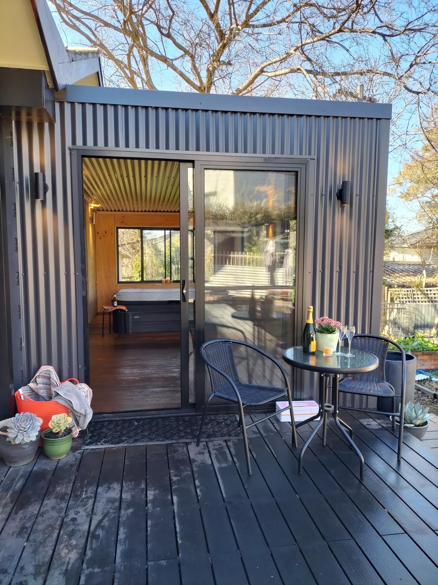 Julie from Curtin, ACT loves COLORBOND® steel. Spa room Roofing, Guttering & Fascia made from COLORBOND® steel in colours Monument® and Dune® Matt