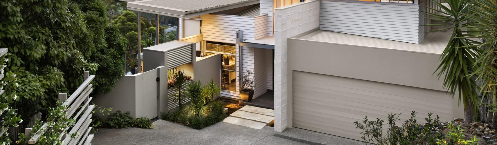 Denman House, residence featuring  COLORBOND® steel roofing and garage door in the colour Dune®. Photographer: Simon Devitt Photographer Ltd